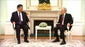 Putin welcomes Xi to the Kremlin