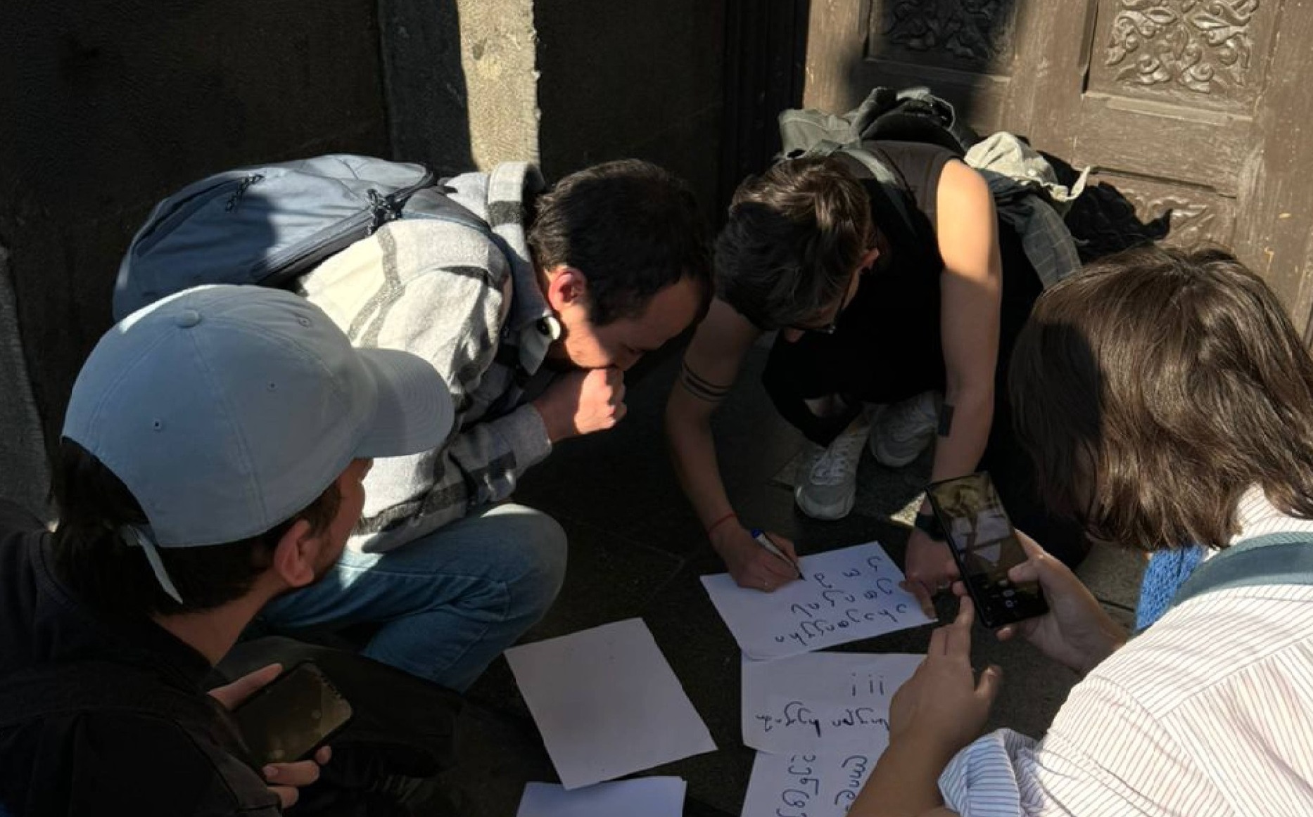 Students gathered at the Theatre University announce a defiance protest