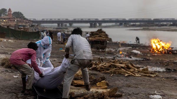 India Covid: Dozens of bodies wash up on banks of Ganges river
